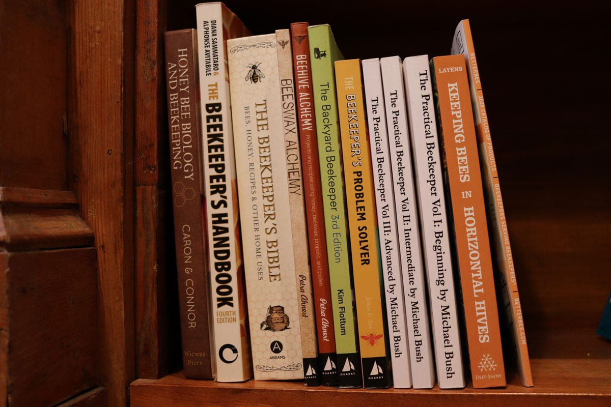 Beekeeping books on a shelf