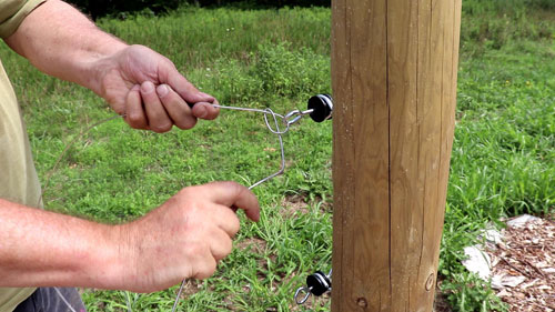 Tying a fence knot to the gate anchor