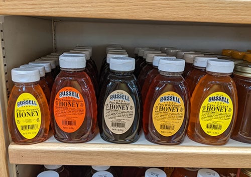 Honey varietals on store shelf.