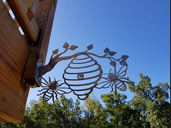 Stainless steel beehive and bees on E