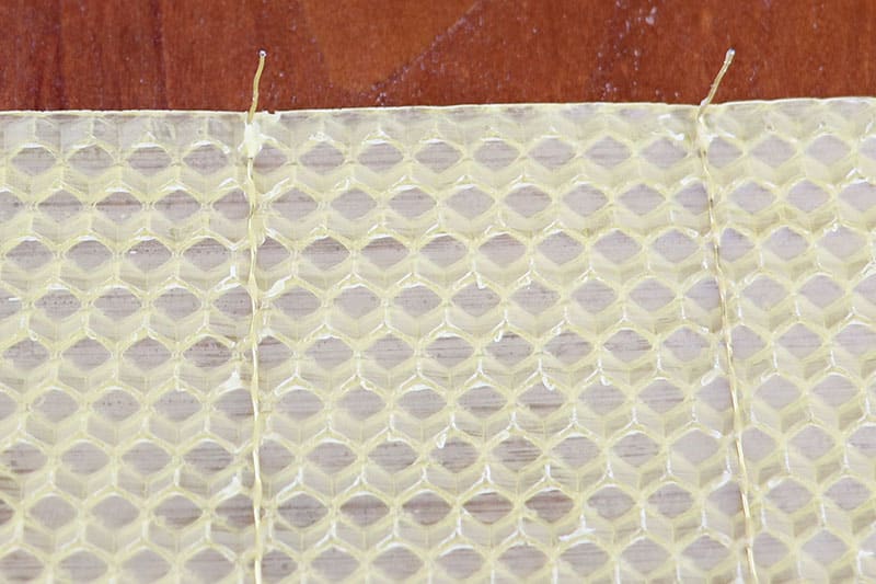 Close up of wired wax foundation with hooks
